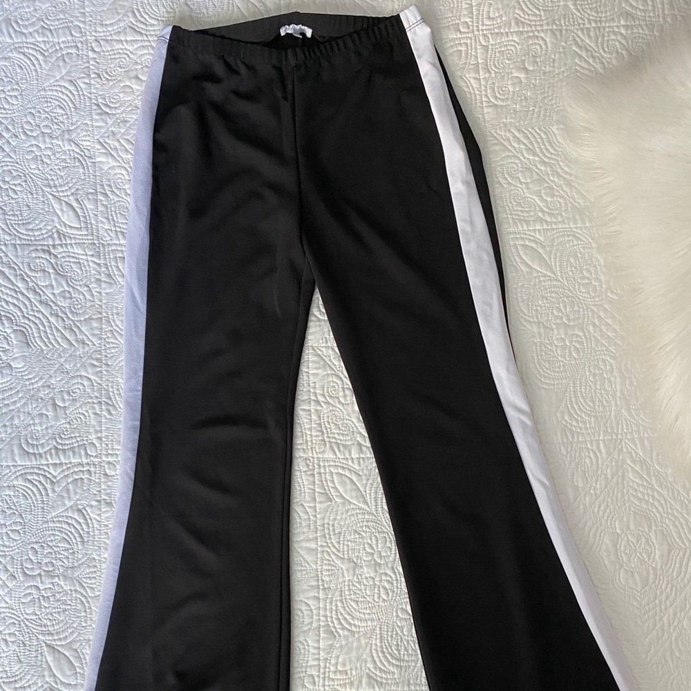 Black bellbottom pants with white stripes